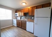 Thumbnail 29 of 103 - Kitchen with Refrigerator at Willowbrooke Apartments & Townhomes at 396 Willowbrooke Drive in Brockport, NY 14420