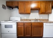 Thumbnail 27 of 103 - Kitchen with cabinets at Willowbrooke Apartments & Townhomes at 396 Willowbrooke Drive in Brockport, NY 14420