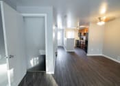 Thumbnail 19 of 103 - a view of a living room and kitchen from the doorway of an empty apartment at Willowbrooke Apartments, Brockport