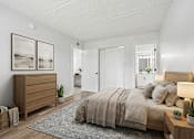 Thumbnail 18 of 58 - Primary bedroom with ensuite bathroom and wooden furniture at The Residences at Soho Apartments, Florida