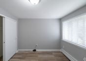 Thumbnail 7 of 15 - an empty room with a large window and a closet