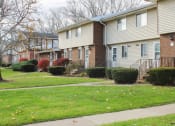 Thumbnail 89 of 103 - a row of houses on a sidewalk in a neighborhood at Willowbrooke Apartments, Brockport, New York