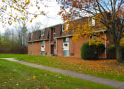 Thumbnail 91 of 103 - a red brick house with a sidewalk in front of it at Willowbrooke Apartments, New York