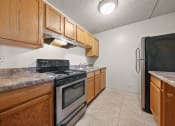 Thumbnail 72 of 111 - Upgraded Kitchen with cabinets at Woodland Ridge Apartments in Woodridge, IL