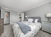 Thumbnail 22 of 111 - Renovated Bedroom with bed at Woodland Ridge Apartments in Woodridge, IL