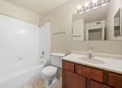Thumbnail 80 of 111 - Bathroom with mirror and cabinets at Woodland Ridge Apartments in Woodridge, IL