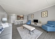 Thumbnail 18 of 111 - Renovated Living Room with frames at Woodland Ridge Apartments in Woodridge, IL