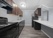 Thumbnail 31 of 111 - Renovated Kitchen at Woodland Ridge Apartments in Woodridge, IL