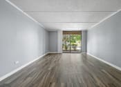 Thumbnail 40 of 111 - Renovated Living Room with white interior decor at Woodland Ridge Apartments in Woodridge, IL