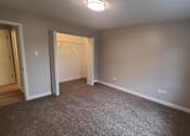 Thumbnail 32 of 48 - an empty room with a door to a closet and a window