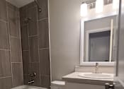 Thumbnail 36 of 48 - a small bathroom with a toilet sink and bath tub
