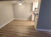 Thumbnail 35 of 48 - a living room with wood flooring and a ceiling fan