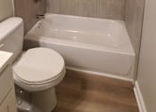 Thumbnail 44 of 48 - a bathroom with a toilet and a bath tub and a shower curtain