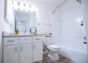 Thumbnail 9 of 36 - a white bathroom with a toilet and a sink