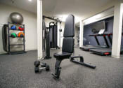 Thumbnail 36 of 49 - a gym with a lot of equipment in it