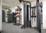 Thumbnail 37 of 49 - a home gym with weights and other equipment