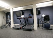 Thumbnail 35 of 49 - a room filled with lots of exercise equipment