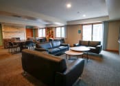 Thumbnail 34 of 49 - a living room filled with furniture and a flat screen tv