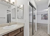 Thumbnail 14 of 49 - a bathroom with a sink and a mirror