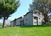 Thumbnail 1 of 25 - apartment building and grassy area