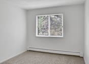 Thumbnail 57 of 67 - A window with a view of trees and a house.