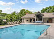 Thumbnail 58 of 67 - A pool with a building behind it.