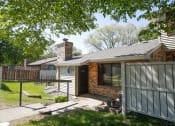 Thumbnail 1 of 36 - a view of the front of a house with a fence and a yard