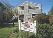 Thumbnail 8 of 13 - Woodcreek Village Exterior Building and Sign