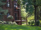 Thumbnail 9 of 49 - a wooden deck in front of a brick house