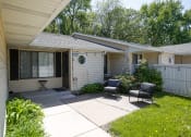 Thumbnail 2 of 36 - the backyard of a white house with a patio and chairs