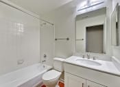 Thumbnail 33 of 36 - a bathroom with a sink toilet and a bath tub