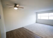 Thumbnail 13 of 18 - an empty room with a ceiling fan and a window