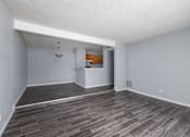 Thumbnail 14 of 19 - A room with a grey floor and white walls.