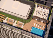 Thumbnail 15 of 15 - A top-down view of a pool area with lounge chairs and a green lawn.