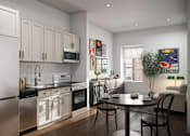 Thumbnail 5 of 36 - A modern kitchen with a dining table and chairs.
