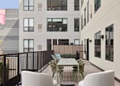 Thumbnail 23 of 24 - Patio with a table and chairs at 23 West Apartments, Philadelphia, PA, 19123