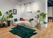 Thumbnail 46 of 54 - A living room with a white couch, a green rug, and a coffee table.