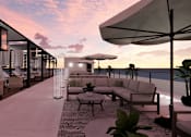 Thumbnail 10 of 15 - A modern outdoor seating area with a view of the water.