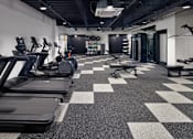Thumbnail 18 of 23 - A gym with treadmills, weights, and a checkerboard floor. at The Weaver, Philadelphia, PA, 19125