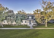 Thumbnail 1 of 46 - the front of a house with trees and a sidewalk  at Sunset Ridge, San Antonio, TX, 78209