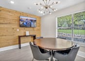 Thumbnail 30 of 46 - a dining room with a table and chairs and a large window at Sunset Ridge, San Antonio, TX, 78209