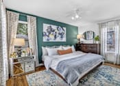 Thumbnail 13 of 46 - a bedroom with green walls and a white bed at Sunset Ridge, Texas, 78209