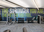 Thumbnail 46 of 87 - a fitness room with a wall mural that says the stronger you are the fit you at Beekman on Broadway, Ann Arbor, MI