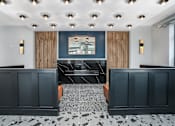 Thumbnail 86 of 87 - a view of a lobby with black and white tiles and a blue wall with a at Beekman on Broadway, Michigan, 48105