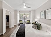 Thumbnail 5 of 48 - Modern bedroom with walk-in closet and reading nook at Nalle Woods of Westlake Apartments, Austin, 78746