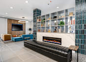 Thumbnail 37 of 87 - a living room with a fireplace and a tv at Beekman on Broadway, Ann Arbor, Michigan