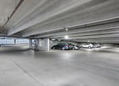 Thumbnail 82 of 87 - a parking garage with cars parked in it at Beekman on Broadway, Ann Arbor, MI