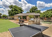 Thumbnail 37 of 46 - a tennis court and ping pong table in the backyard of a home  at Sunset Ridge, San Antonio