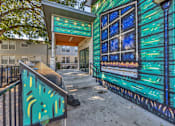 Thumbnail 44 of 46 - the entrance to a building with a blue and green painted wall  at Sunset Ridge, San Antonio, Texas