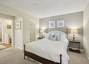 Thumbnail 11 of 32 - Bedroom with large bed at Radbourne Lake Apartments, Charlotte, NC
